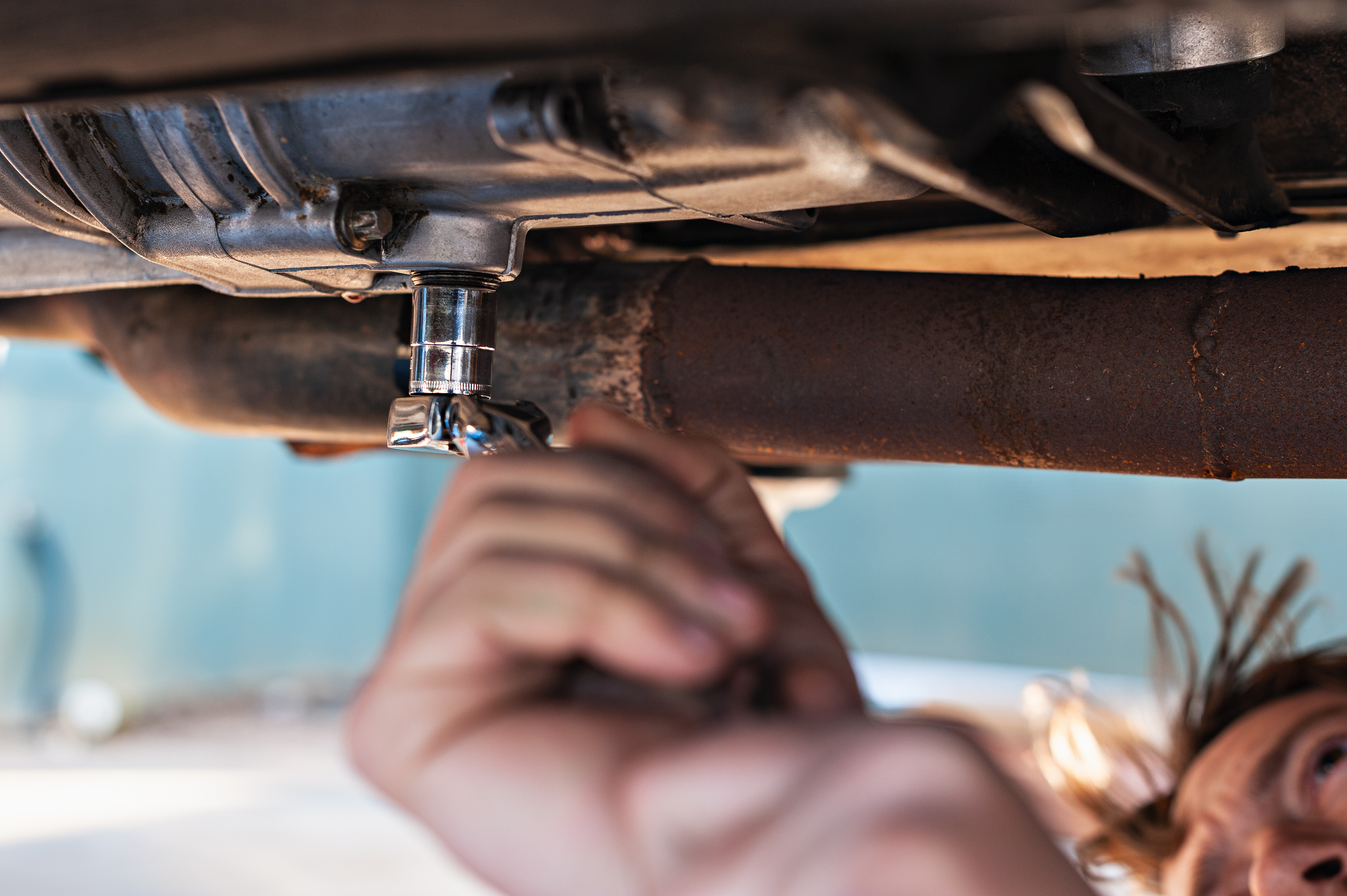 Homefront mobile mechanic working on car in Austin driveway